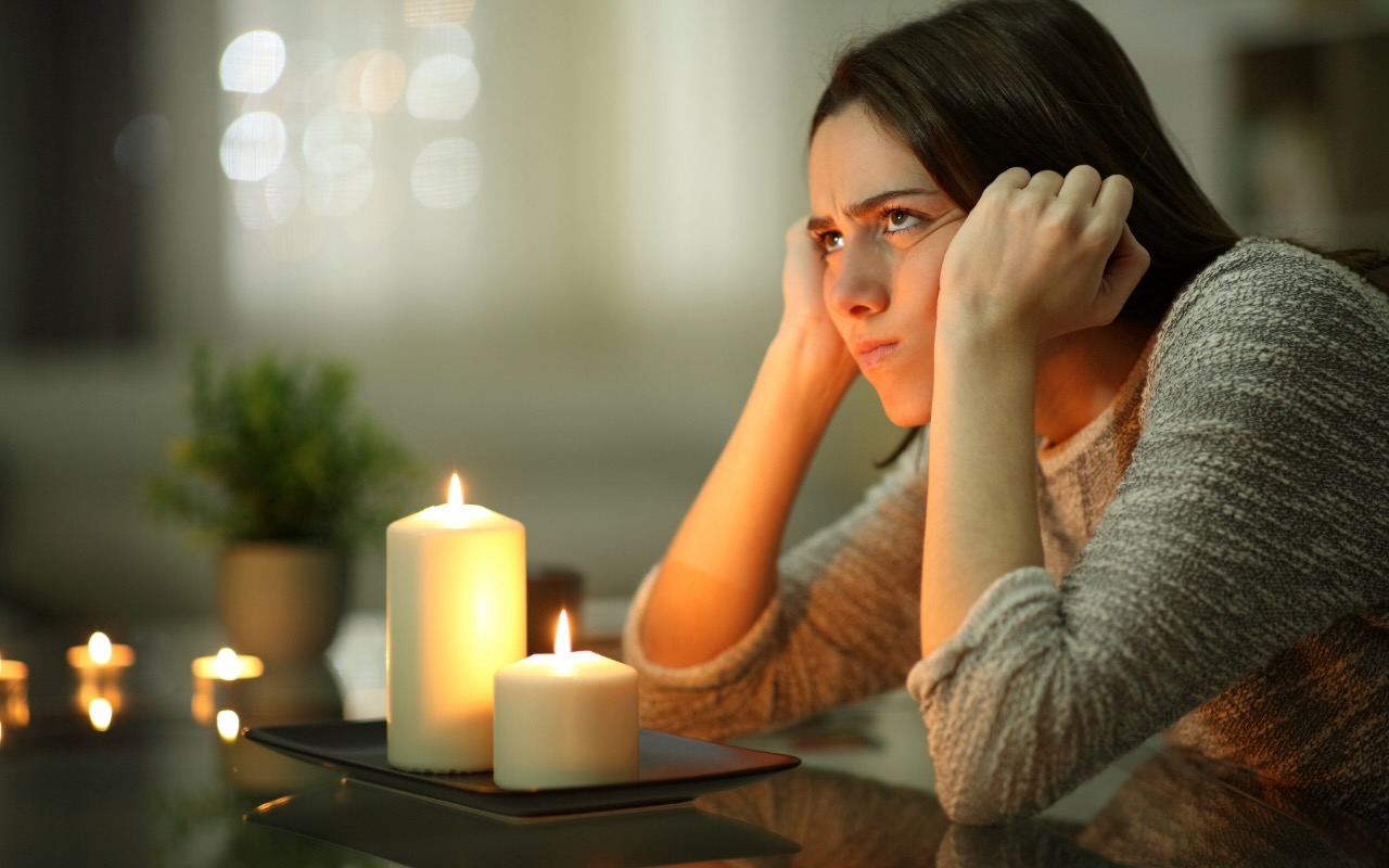 Hurricane - lights out - candles as backup - frustrated homeowner